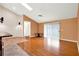 Bright living room with hardwood floors, sliding glass doors, and a ceiling fan at 1341 American Elm Dr, Altamonte Springs, FL 32714