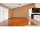 Hardwood flooring and neutral walls in living room, paired with a large window and sliding glass door at 1341 American Elm Dr, Altamonte Springs, FL 32714