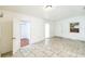 Bright living room with tile floors and a view of the entry door at 1408 N Pine Hills Rd, Orlando, FL 32808