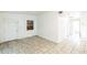 View of the living room showing the entry door and hall and tile floors at 1408 N Pine Hills Rd, Orlando, FL 32808