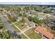 Overhead view of a neighborhood featuring single-Gathering homes surrounded by lush green trees and yards at 1417 Independence Ave, Deltona, FL 32725