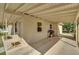 Covered patio area ideal for outdoor grilling and entertainment, featuring a concrete floor and ample space at 1417 Independence Ave, Deltona, FL 32725