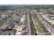 View of homes with tree-lined streets and community water feature in the background at 14472 Chinese Elm Dr, Orlando, FL 32828