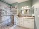 Stylish bathroom featuring a tiled shower with glass door, neutral wall color, and ample lighting at 14472 Chinese Elm Dr, Orlando, FL 32828