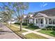 Charming townhouse exterior with well-maintained lawn and landscaping in a desirable neighborhood at 14472 Chinese Elm Dr, Orlando, FL 32828