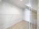 Spacious walk-in closet with ample shelving and tile flooring at 14472 Chinese Elm Dr, Orlando, FL 32828