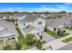 Bird's eye view of a two-story home in a residential neighborhood, featuring solar panels on the roof at 1472 Rushing Rapids Way, Winter Springs, FL 32708