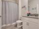 Clean and bright bathroom featuring a vanity with gray countertop and a shower with gray shower curtain at 1472 Rushing Rapids Way, Winter Springs, FL 32708