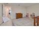 A Bedroom with carpeted floors features neutral walls, with adjacent furniture including a changing table and small toy shelving at 1472 Rushing Rapids Way, Winter Springs, FL 32708