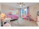 room with toys has ceiling fan, large window, and neutral carpet at 1472 Rushing Rapids Way, Winter Springs, FL 32708