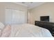 Bedroom featuring a closet with double doors, a dresser, and a comfortable bed at 1472 Rushing Rapids Way, Winter Springs, FL 32708