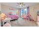 Vibrant bedroom with lots of natural light and playful decor at 1472 Rushing Rapids Way, Winter Springs, FL 32708