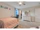 Bright bedroom with desk space features a closet and ceiling fan at 1472 Rushing Rapids Way, Winter Springs, FL 32708