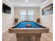 Entertaining game room with a pool table and a wall-mounted television for leisure at 1472 Rushing Rapids Way, Winter Springs, FL 32708