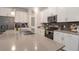 Spacious kitchen island with stainless appliances, modern fixtures, and gray countertops at 1472 Rushing Rapids Way, Winter Springs, FL 32708