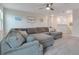 Upstairs loft area with plush carpeting, a comfortable sectional sofa, and ample space at 1472 Rushing Rapids Way, Winter Springs, FL 32708