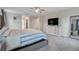 Bright main bedroom with a ceiling fan, dresser, and large bed at 1472 Rushing Rapids Way, Winter Springs, FL 32708