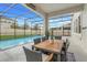 Outdoor dining area with screened-in pool and patio at 1472 Rushing Rapids Way, Winter Springs, FL 32708