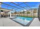 The screened-in outdoor pool features a patio, green grass, and an architectural design ideal for relaxing and entertaining at 1472 Rushing Rapids Way, Winter Springs, FL 32708