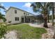 Expansive backyard with screened pool, manicured lawn, and lush landscaping; perfect for outdoor enjoyment at 15143 Ovation Dr, Winter Garden, FL 34787