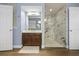 Stylish bathroom featuring a modern vanity, marble shower, and decorative accents at 15143 Ovation Dr, Winter Garden, FL 34787