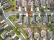 Aerial view of home and neighborhood, showcasing nearby streets, trees, and landscaping at 20945 Oldenburg Loop, Mount Dora, FL 32757