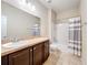 Well-lit bathroom with a modern vanity, a sink, a toilet, and a shower and tub combo at 20945 Oldenburg Loop, Mount Dora, FL 32757