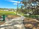 Community trail beside a greenbelt and pond at 20945 Oldenburg Loop, Mount Dora, FL 32757