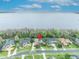 Beautiful aerial view of waterfront homes with lush landscaping and screened in pools, showcasing a desirable neighborhood at 210 Torcaso Ct, Winter Springs, FL 32708
