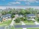 Neighborhood with stunning lake views and serene waterfront homes with lush landscaping and beautiful architecture at 210 Torcaso Ct, Winter Springs, FL 32708