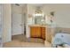 Elegant bathroom featuring marble countertops, a separate tub, and plenty of natural light at 210 Torcaso Ct, Winter Springs, FL 32708