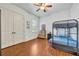 Comfortable bedroom with ceiling fan, large closet, laminate floors and natural light from the window at 210 Torcaso Ct, Winter Springs, FL 32708