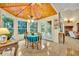 Bright breakfast nook with wood ceiling, ample windows, and a table with seating for casual dining at 210 Torcaso Ct, Winter Springs, FL 32708