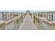 Detailed dock view with seating, showing a well-maintained structure leading to the expansive waterfront at 210 Torcaso Ct, Winter Springs, FL 32708