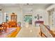 Bright foyer with tile flooring, white trim, and views into the living room and access to other areas at 210 Torcaso Ct, Winter Springs, FL 32708