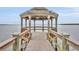 Waterside gazebo offering a picturesque view of calm water and a serene horizon at 210 Torcaso Ct, Winter Springs, FL 32708