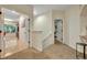 Bright upstairs hallway with doorways leading to different rooms in the house at 210 Torcaso Ct, Winter Springs, FL 32708