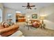 Comfortable living room with neutral colors and a seamless transition to the adjacent kitchen with wood cabinets at 210 Torcaso Ct, Winter Springs, FL 32708