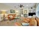 Relaxing living room featuring a fireplace, built-in shelving, and comfy seating, perfect for Gathering time at 210 Torcaso Ct, Winter Springs, FL 32708