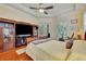 Large main bedroom featuring hardwood floors, a ceiling fan, and a view to the outside at 210 Torcaso Ct, Winter Springs, FL 32708