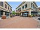 Charming outdoor seating area with tables and chairs in a brick-paved pedestrian-friendly commercial area at 210 Torcaso Ct, Winter Springs, FL 32708