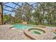 The screened-in pool features a spa and a tranquil water feature, perfect for relaxation and outdoor enjoyment at 210 Torcaso Ct, Winter Springs, FL 32708