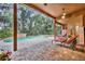 A screened-in pool features a waterfall and brick pavers plus lounge chairs for relaxing outdoors at 210 Torcaso Ct, Winter Springs, FL 32708