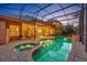 Backyard oasis featuring a screened pool, spa, and patio, ideal for enjoying outdoor living at 210 Torcaso Ct, Winter Springs, FL 32708