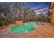 Beautiful pool and spa with brick surround offers a relaxing outdoor retreat with mature trees at 210 Torcaso Ct, Winter Springs, FL 32708