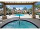 Community pool and hot tub with an outdoor living area and lounge chairs surrounded by palm trees at 2200 Metropolitan Way # 926, Orlando, FL 32839