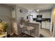 Modern kitchen with stainless steel appliances, granite countertops, and breakfast bar seating at 2200 Metropolitan Way # 926, Orlando, FL 32839