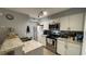 Well-lit kitchen features stainless steel appliances and granite countertops at 2200 Metropolitan Way # 926, Orlando, FL 32839