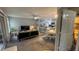 Cozy living room featuring open access to a modern kitchen and plenty of natural light at 2200 Metropolitan Way # 926, Orlando, FL 32839