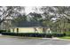 View of the community mailboxes surrounded by trees and bushes in a parking lot at 2200 Metropolitan Way # 926, Orlando, FL 32839